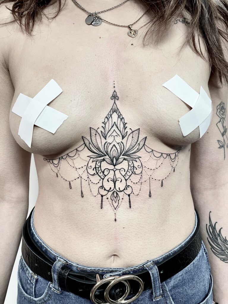 fineline tattoo mandala under boobs