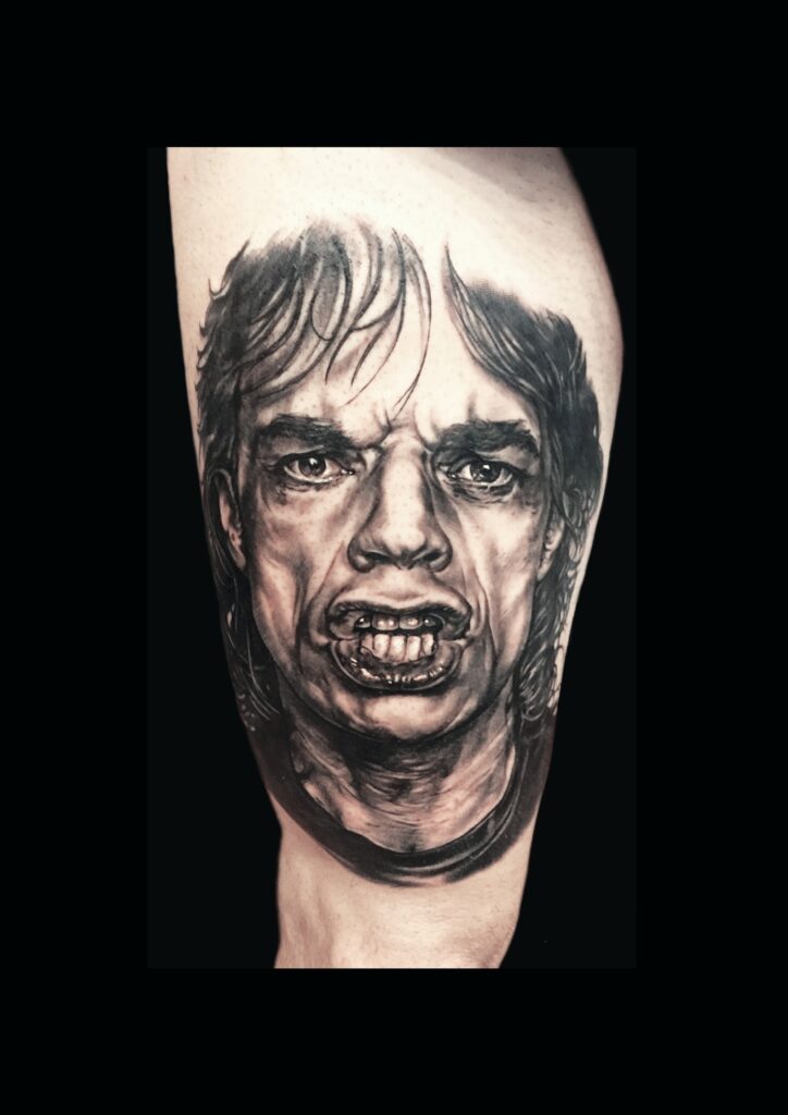realismo tattoo mick jagger